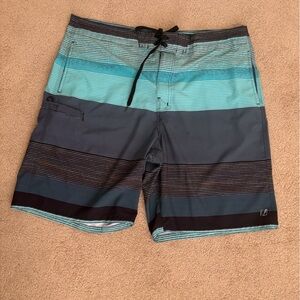 AMPLIFY Blue and Black Board Shorts. Size XL/38